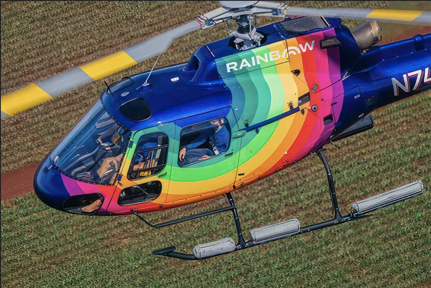 Rainbow Helicopters Airbus Astar flying above farm in Oahu, Hawaii helicopter tour.
