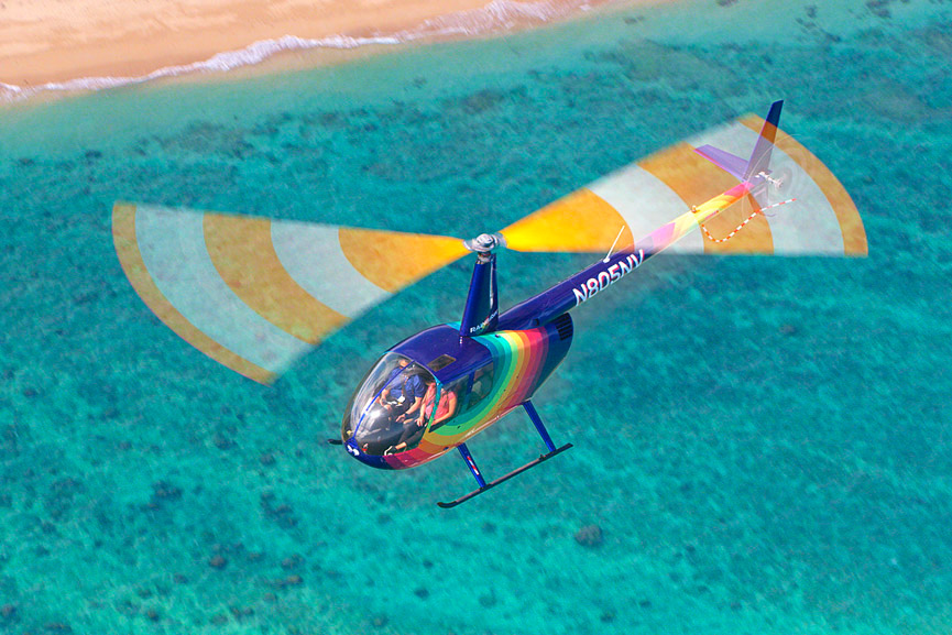 Rainbow Helicopter Tour above blue shoreline