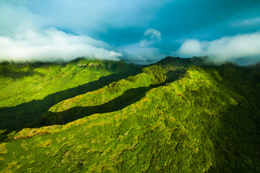 Aerial shot of green mountain in Oahu, Private Helicopter Charters Nu’uanu Pali Lookout tour