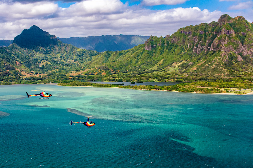 Twin Rainbow Helicopters flying tours over the ocean, Oahu Hawaii