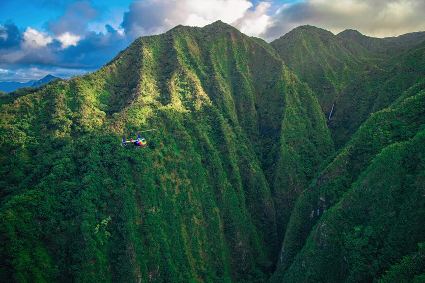 Rainbow Helicopter flying over island of Oahu to Sacred Falls