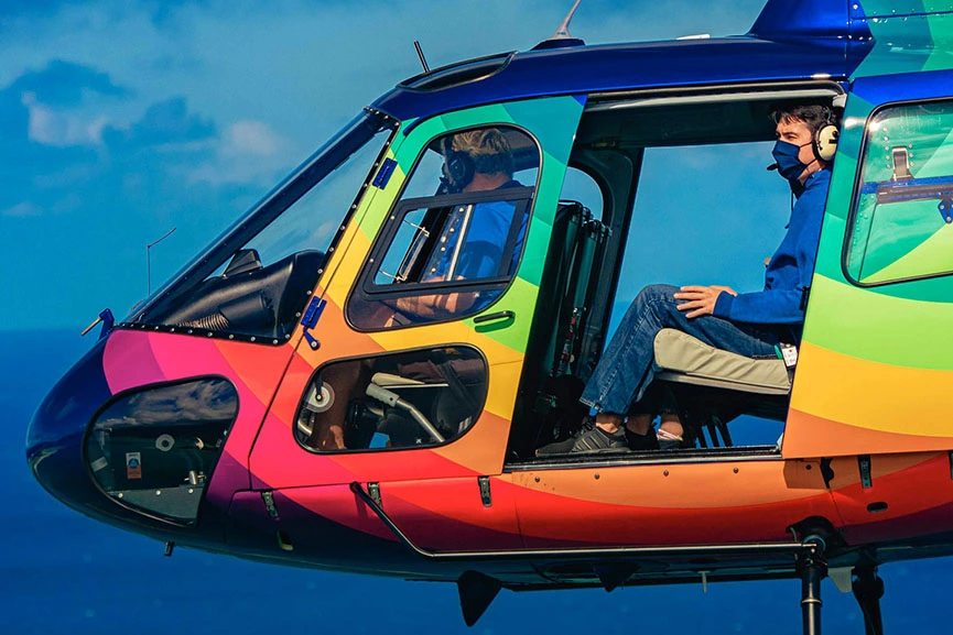 Rainbow helicopter with doors off in Hawaii