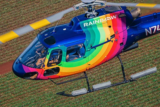 Rainbow Helicopter - Airbus A-star flying over farmland in Oahu