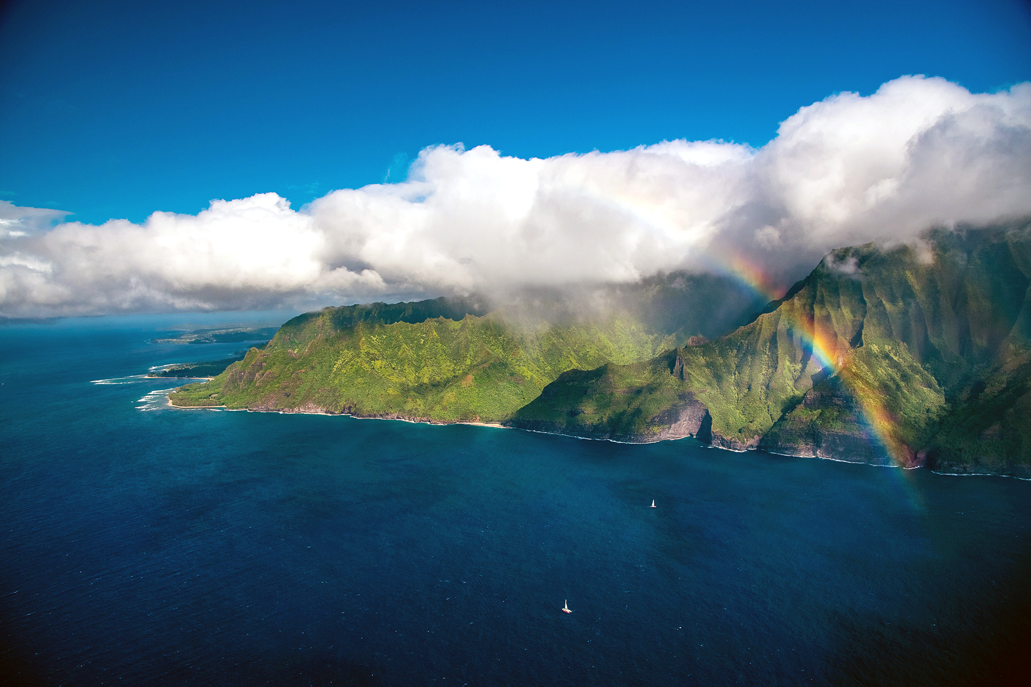 Rainbow Helicopter Views above Sailboats in Hawaii