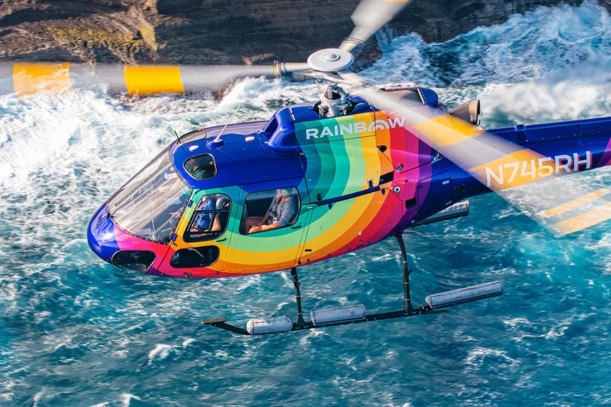 Rainbow Helicopter flying above Oahu coastline