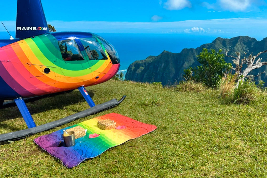Oahu Helicopter Tours | Rainbow Helicopter landed on cliff