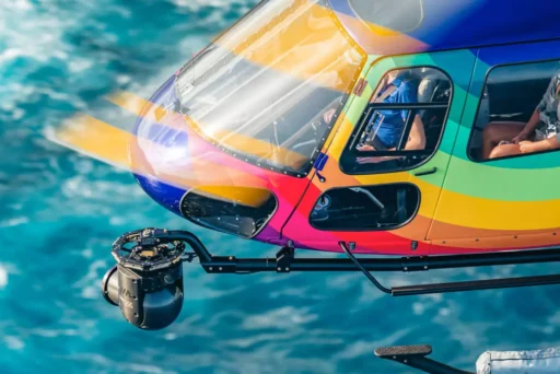 Helicopter Tours Oahu - Rainbow Helicopter Flying Over Ocean With Mount For Aerial Photography
