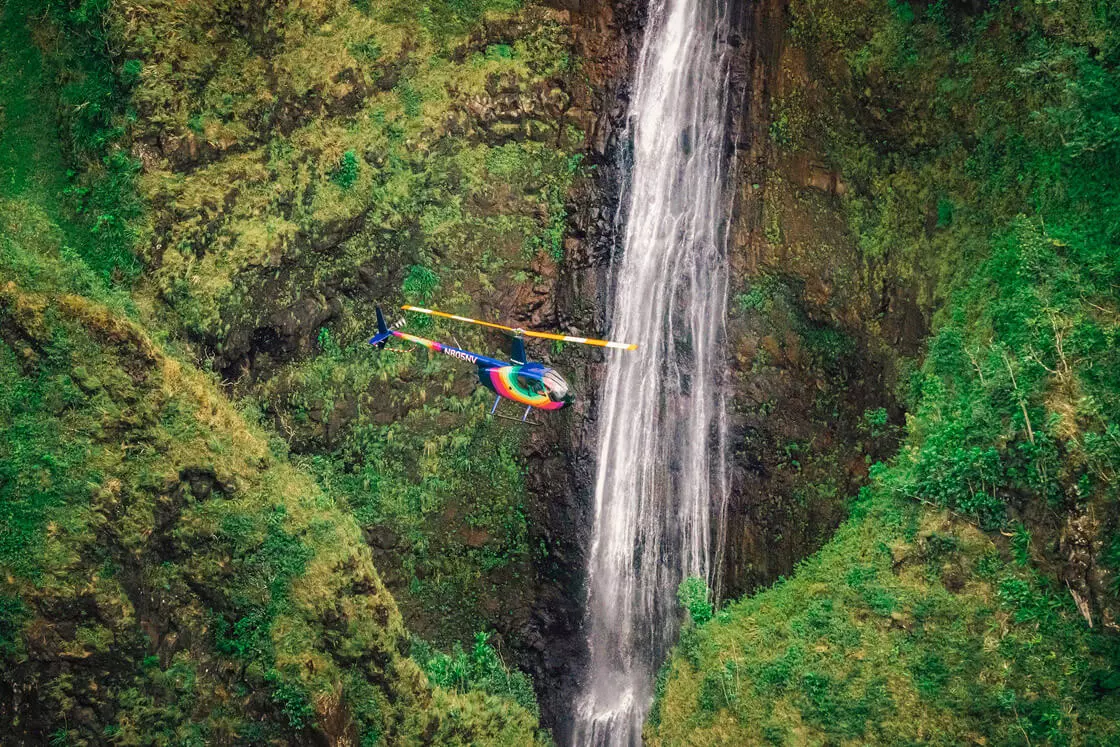 Rainbow Oahu Helicopter Tours - Flying Above The Sacred Falls Waterfall, Oahu Landscape