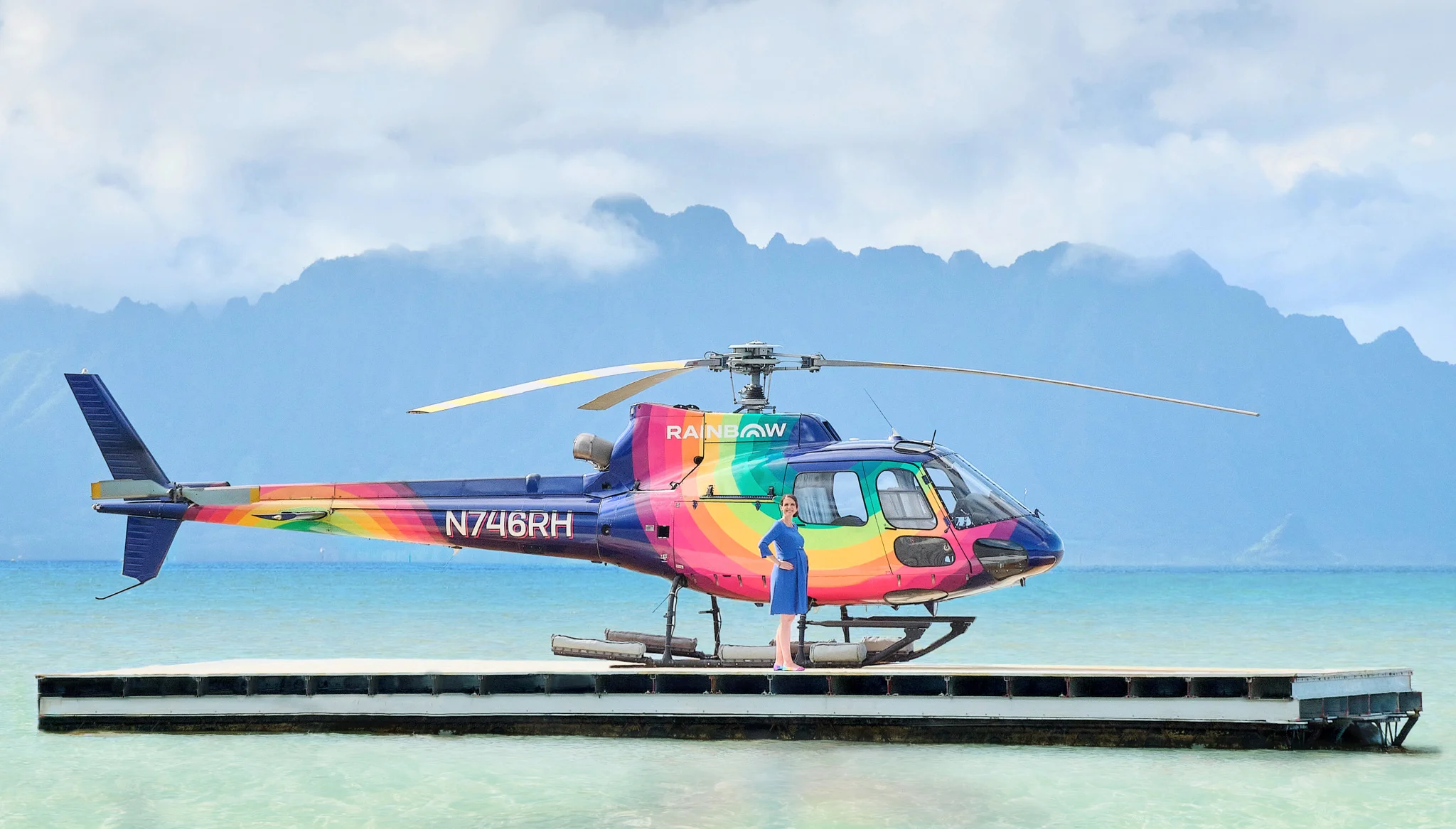 Rainbow CEO and Owner Nicole Battjes with Rainbow Helicopter on helipad on Oahu Sandbar