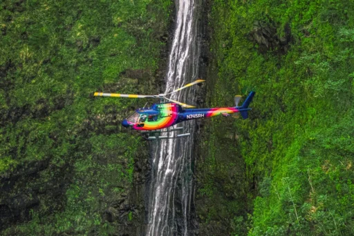 Rainbow Oahu Helicopter Tours Flying Above The Sacred Falls Waterfall.