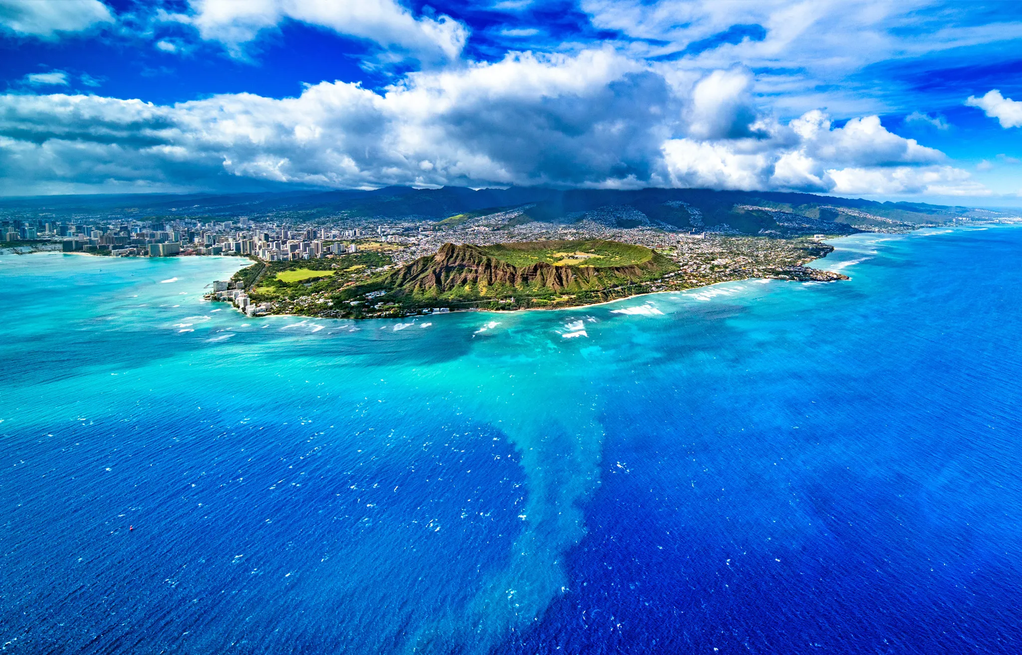 Diamond head Helicopter tour of Oahu photographed from the coast.